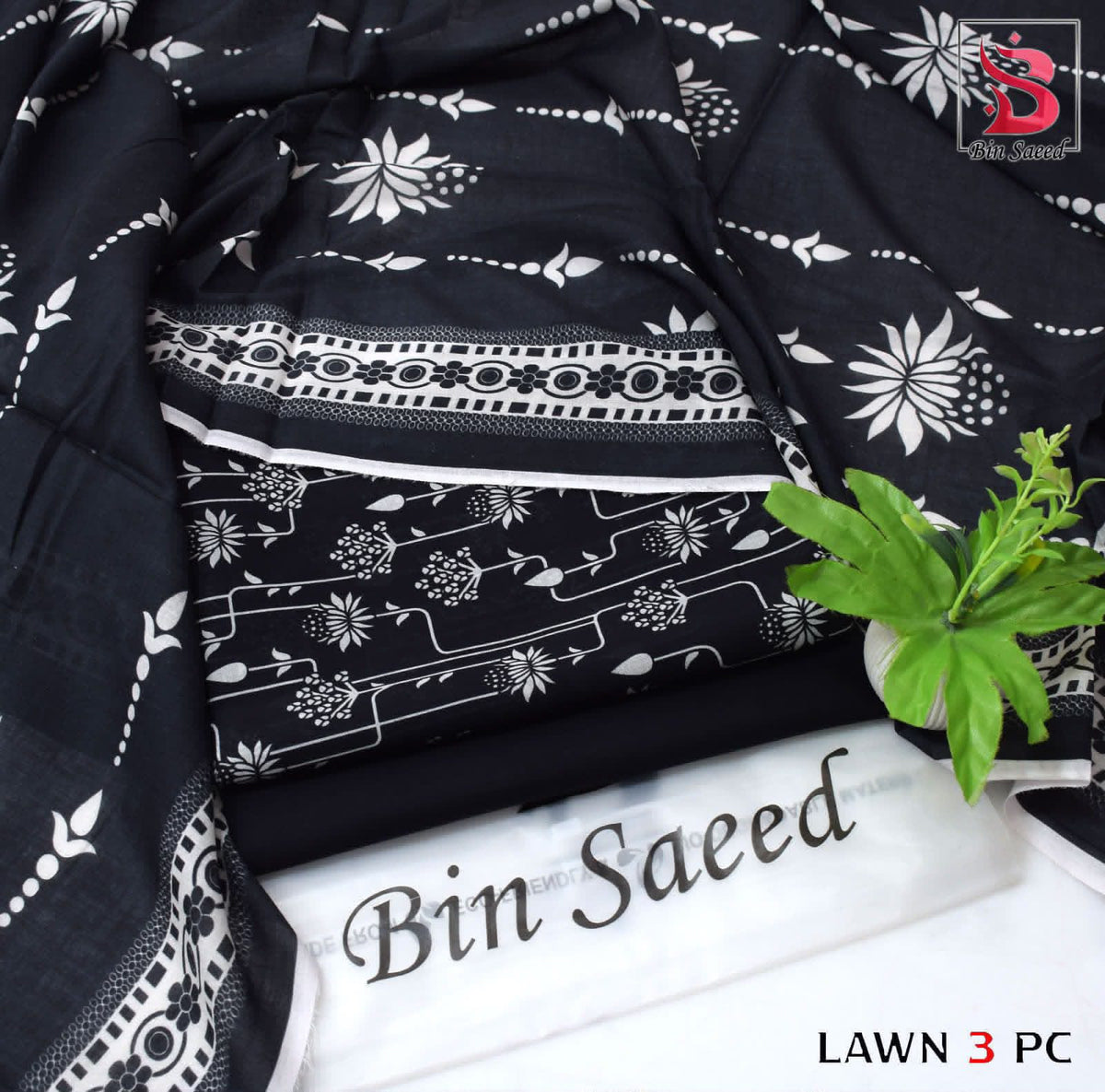 Digital Printed Lawn - 3-Piece Unstitched Collection; Black and White Sprigs, actual fabric and design detail.