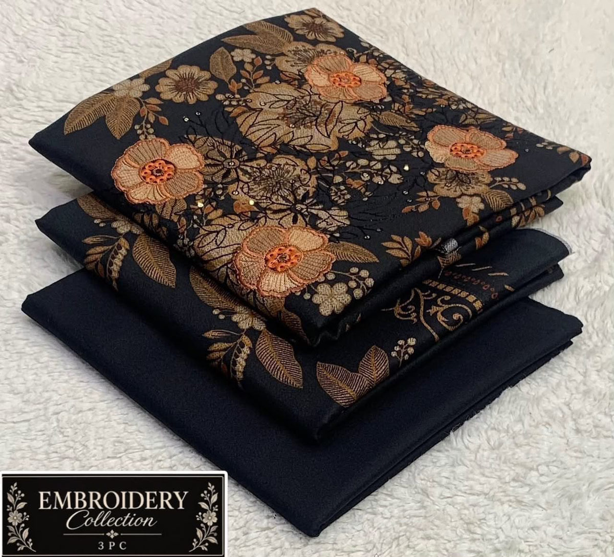 Printed Dhanak with Neckline Embroidery - 3-Piece Unstitched Collection; Black and Gold Floral, actual fabric and design detail.