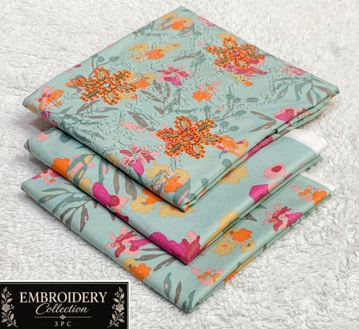 Printed Dhanak with Neckline Embroidery - 3-Piece Unstitched Collection; Mint and Orange Floral, actual fabric and design detail.