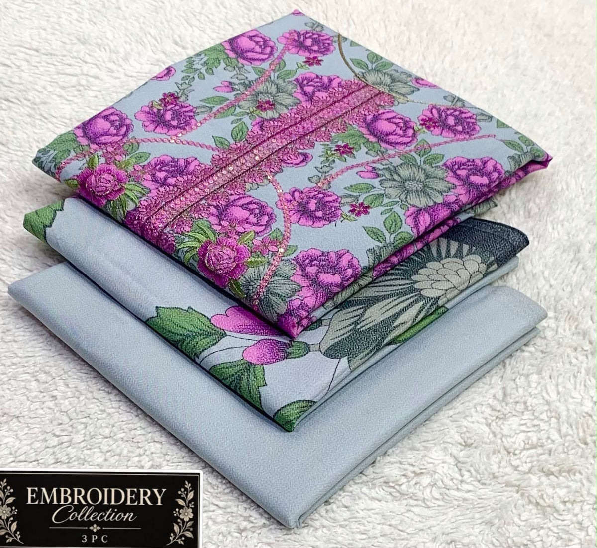 Printed Dhanak with Neckline Embroidery - 3-Piece Unstitched Collection; Aqua and Magenta Floral, actual fabric and design detail.