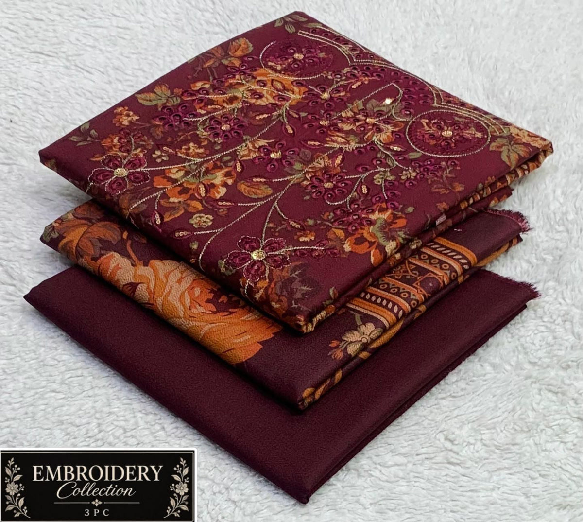Printed Dhanak with Neckline Embroidery - 3-Piece Unstitched Collection; Burgundy Ornate, actual fabric and design detail.