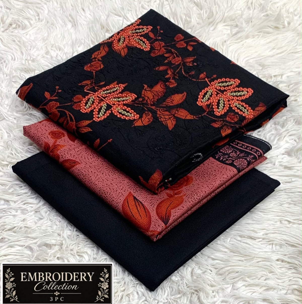 Printed Dhanak with Neckline Embroidery - 3-Piece Unstitched Collection; Black and Orange Botanical, actual fabric and design detail.