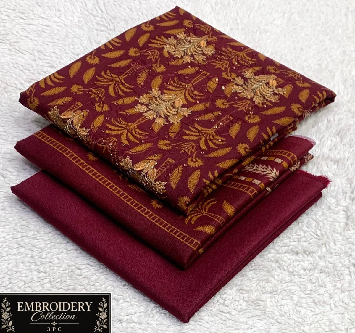 Printed Dhanak with Neckline Embroidery - 3-Piece Unstitched Collection; Burgundy Leaf, actual fabric and design detail.