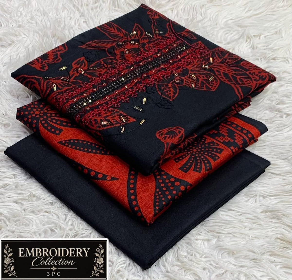 Printed Dhanak with Neckline Embroidery - 3-Piece Unstitched Collection; Black and Red Ornate, actual fabric and design detail.