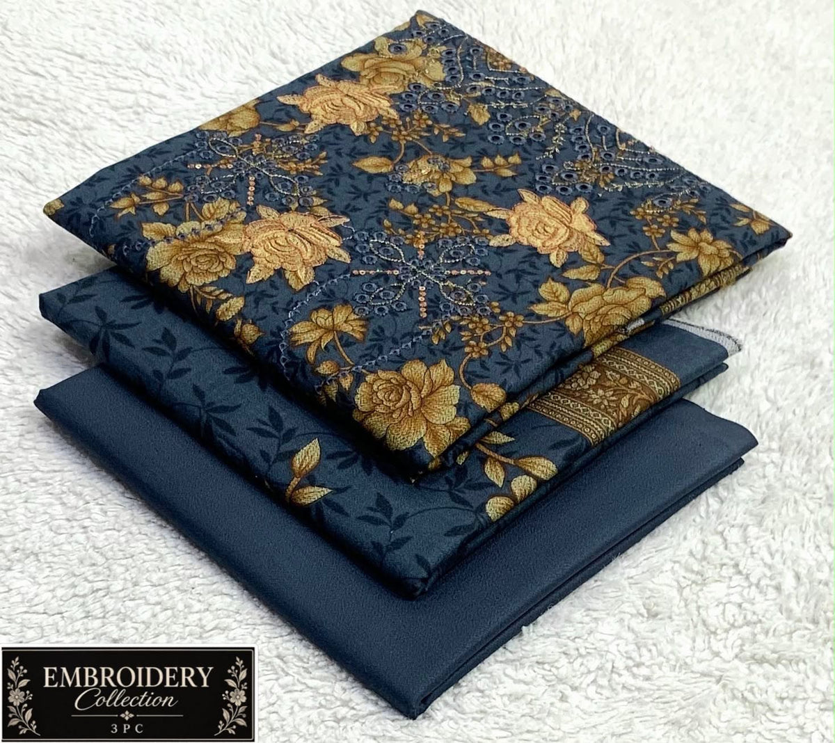 Printed Dhanak with Neckline Embroidery - 3-Piece Unstitched Collection; Navy and Ochre Botanical, actual fabric and design detail.