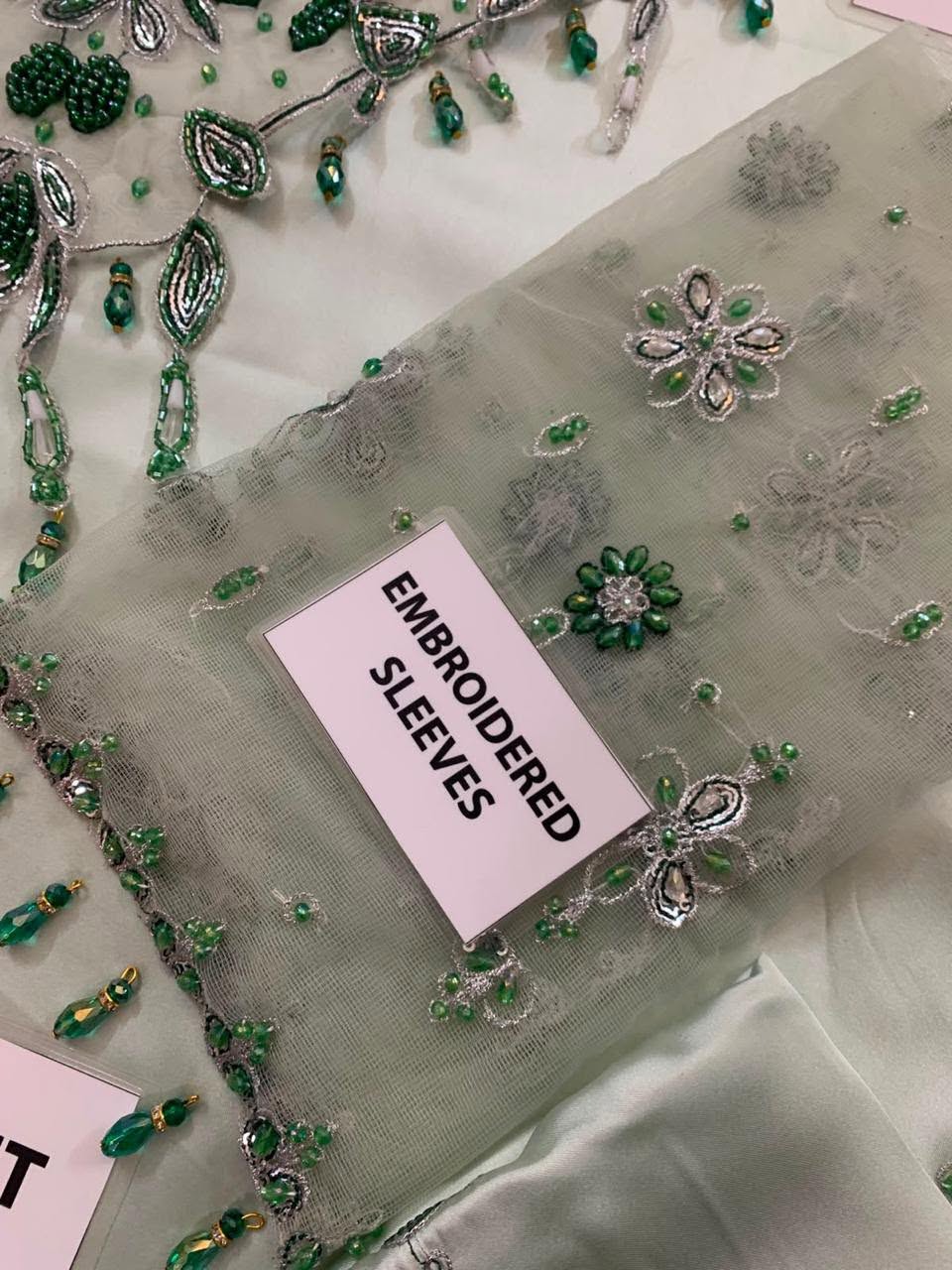 Actual embroidered net sleeve fabric supplied with the Murk mint suit