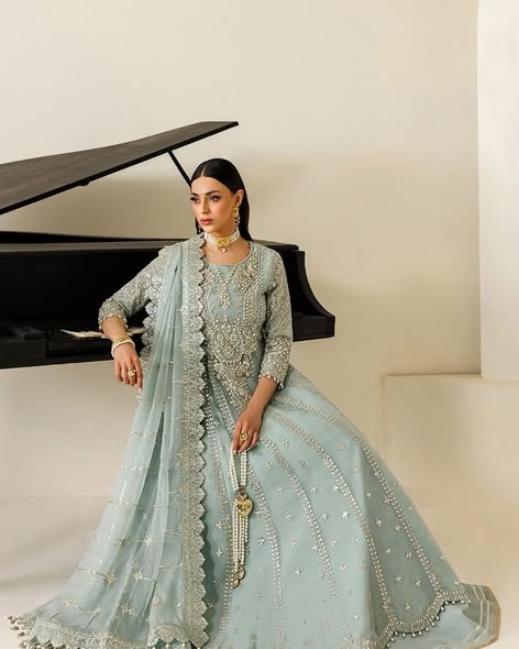 Pale sage embroidered chiffon wedding suit: original seated model photograph